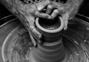 hands molding pottery